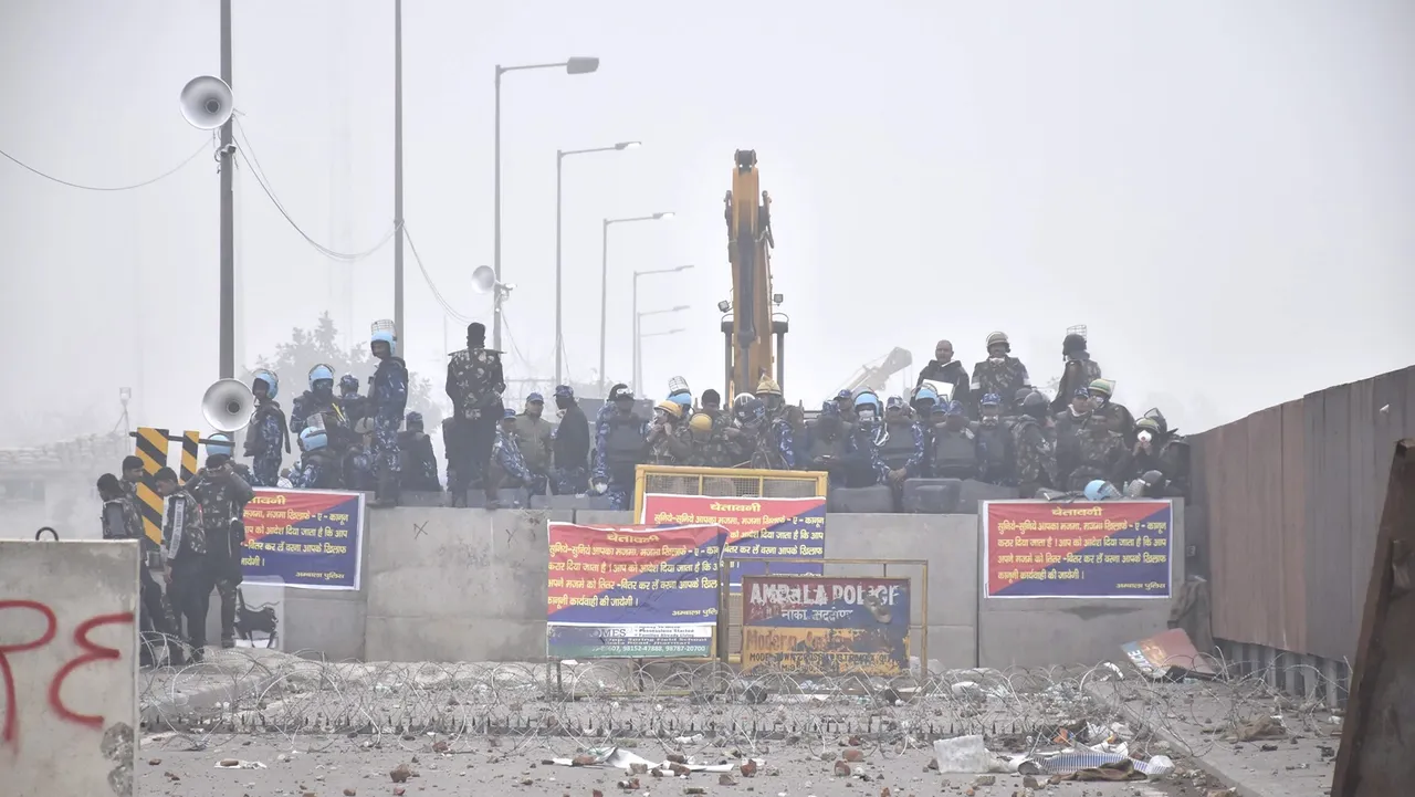 Security personnel stand guard during the protesting farmers' 'Delhi Chalo' march, near the Punjab-Haryana Shambhu Border, in Patiala district