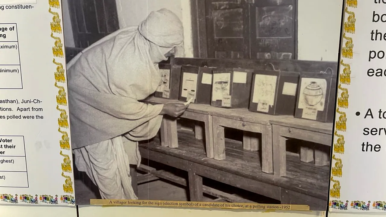 An archival photograph of 1952 showing a voter at a polling station made for the first general elections of India, displayed at a poll museum, in New Delhi