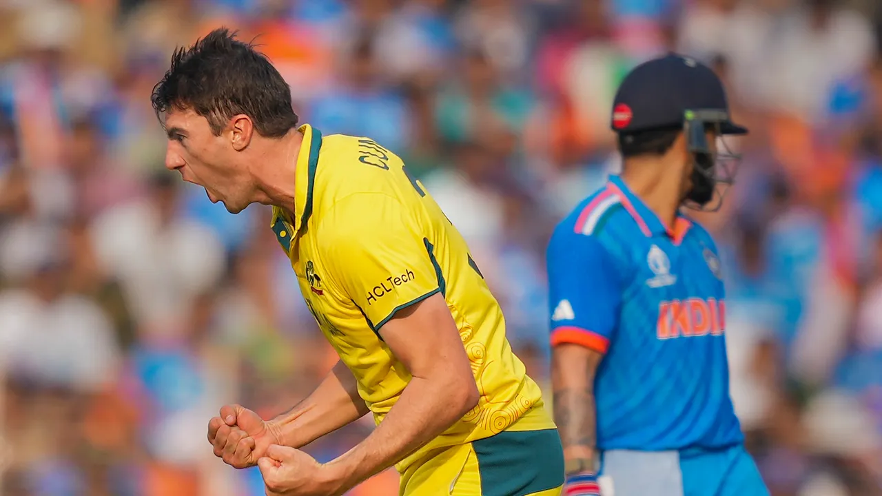 Australia's Pat Cummins with teammates celebrates the wicket of India's Virat Kohli during the ICC Men’s Cricket World Cup 2023 final match