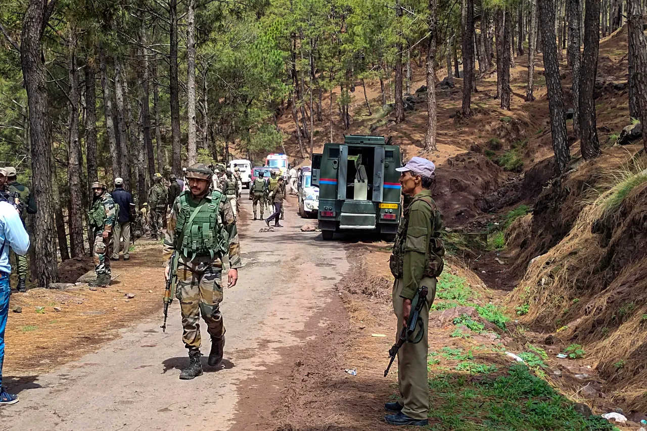 Security personnel at the site after an encounter in the forest area of Dassal Gujran, in Rajouri district