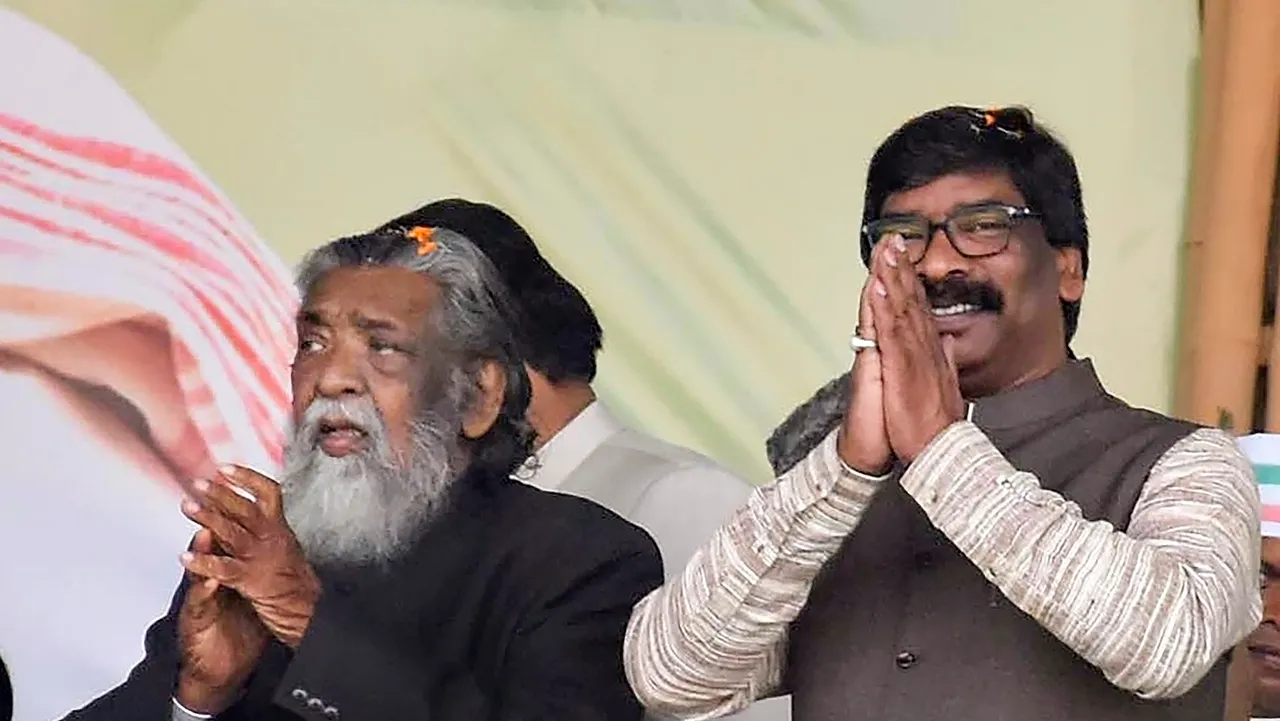 Jharkhand Chief Minister and JMM leader Hemant Soren with his father and party chief Shibu Soren during a programme in Ranchi