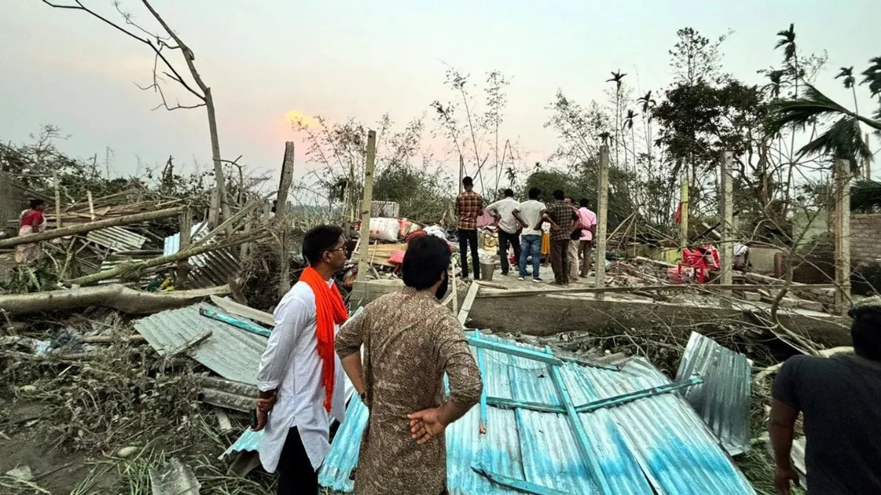 Houses are damaged and electric poles fell after a heavy storm that left at least five people dead, in Jalpaiguri, West Bengal, on March 31