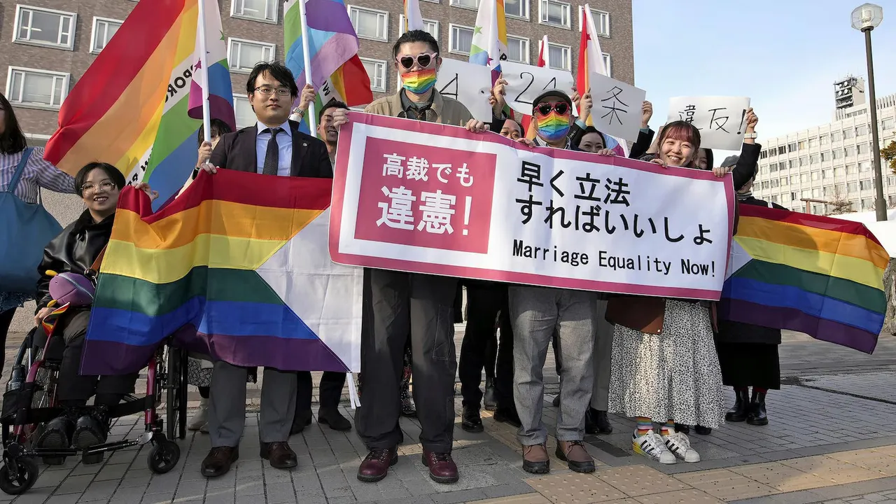 Plaintiffs and others shows a banner in front of Sapporo Hight Court in Sapporo, Hokkaido, northern Japan Thursday, March 14, 2024.