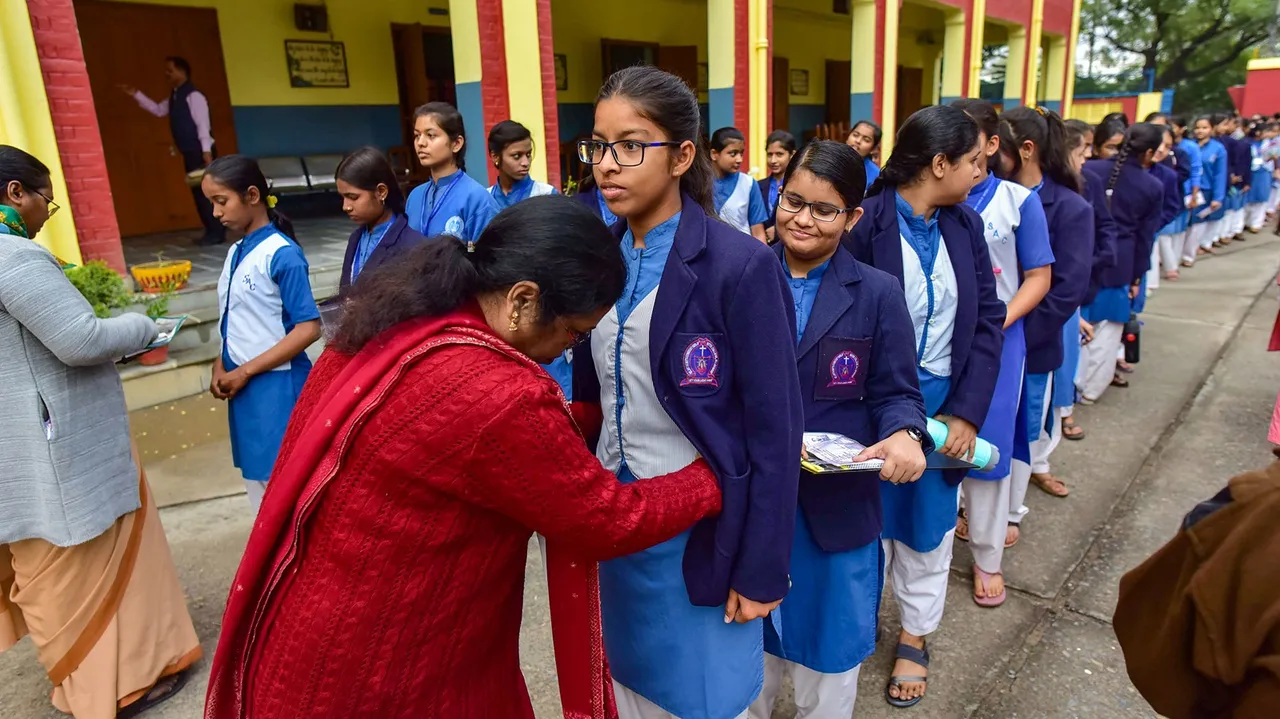 Students being checked at a centre as they arrive to appear in the Board exams of Uttar Pradesh Madhyamik Shiksha Parishad (UPMSP), in Prayagraj