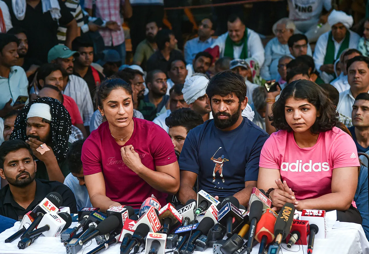 Wrestlers Sakshi Malik, Vinesh Phogat and Bajrang Punia speak with the media during their protest at Jantar Mantar, in New Delhi