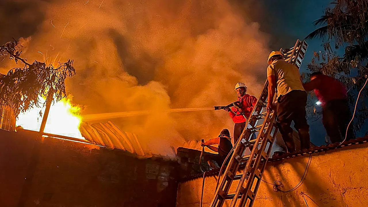 Firefighters try to douse a fire that broke out at a gloves manufacturing factory, in Chhatrapati Sambhajinagar