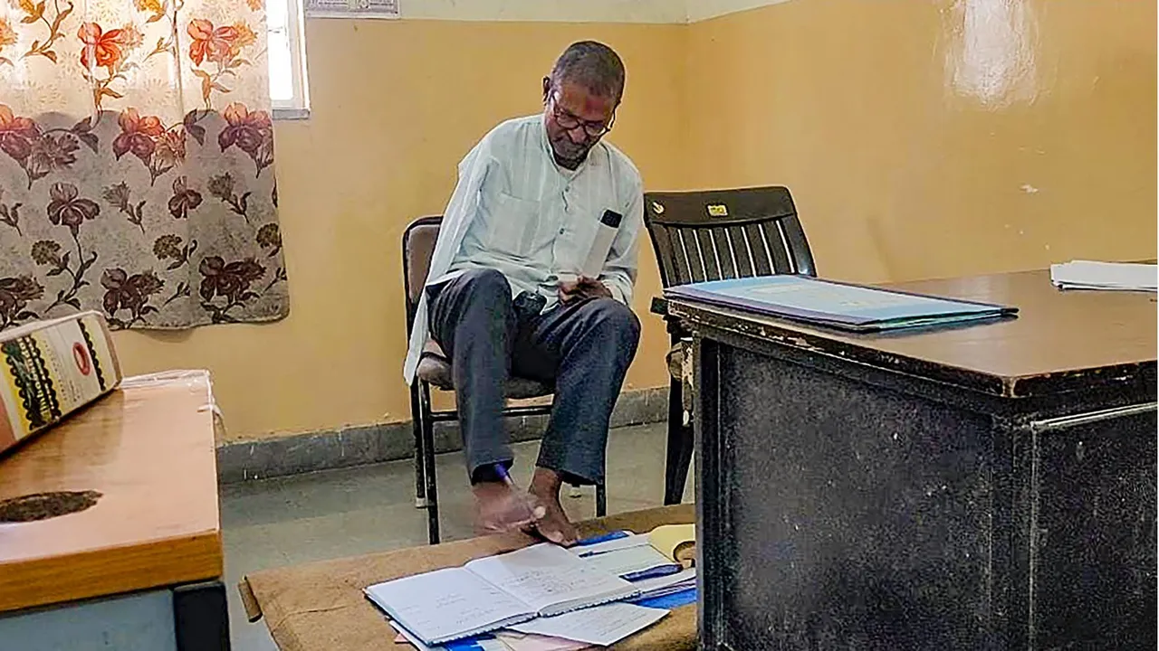 Devkinandan Sharma, a 58-year-old double amputee who learned to write with his toes after losing both his arms at the age of 18 due to an electric shock