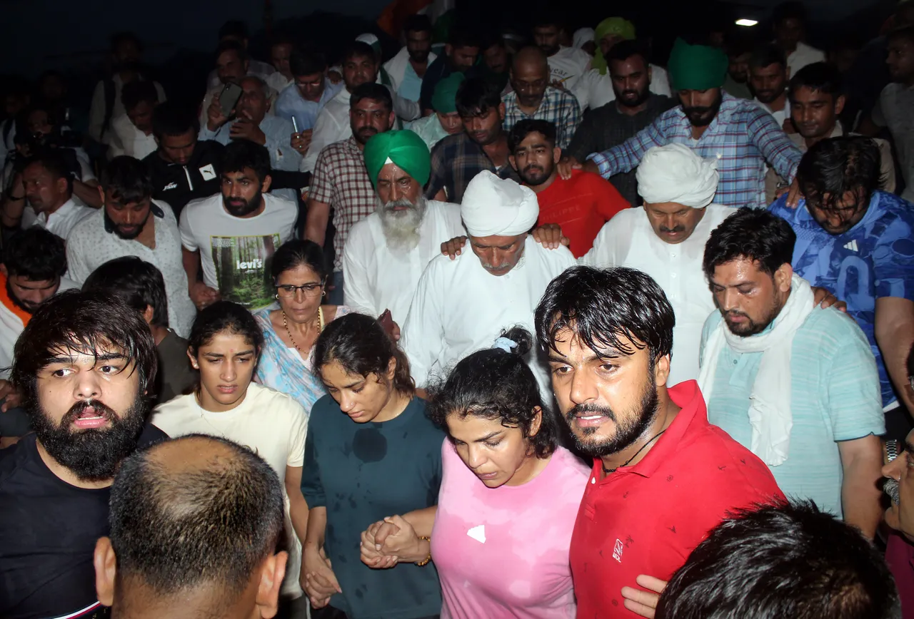 Protesting wrestlers Sakshi Malik, Vinesh Phogat and Sangeeta Phogat at Har ki Pauri ghat, in Haridwar