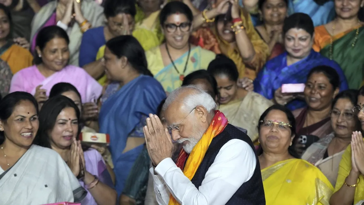 Prime Minister Narendra Modi greets women MPs with folded hands as they celebrate after the passage of the Nari Shakti Vandan Adhiniyam (women's reservation bill) by the Rajya Sabha in the special session of the Parliament, in New Delhi, Thursday, Sept. 21, 2023.