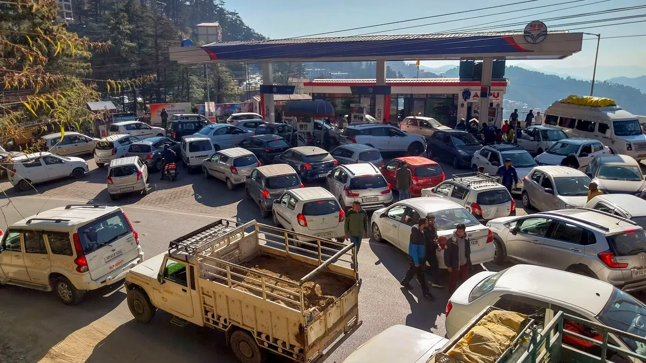 Heavy rush at a petrol pump following the nationwide strike of truck drivers against a provision in the new penal law on hit-and-run accident cases, in Shimla