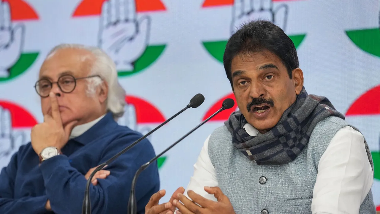 Congress leader KC Venugopal speaks as party leader Jairam Ramesh looks on during a press conference at AICC Headquarters, in New Delhi