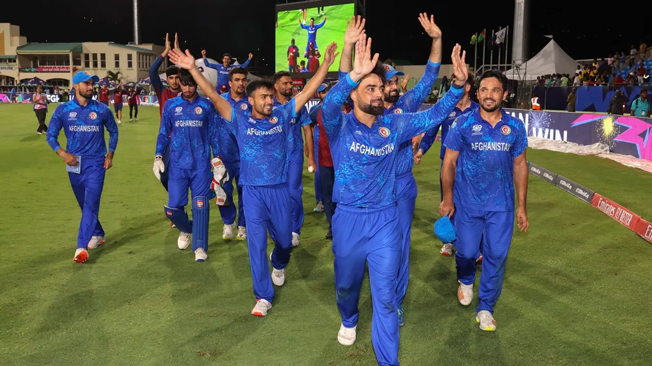 Afghanistan's captain Rashid Khan with teammates acknowledges fans after Afghanistan won the ICC Men's T20 World Cup cricket match against Bangladesh, at Arnos Vale Ground, Kingstown, Saint Vincent and the Grenadines, Monday, June 24, 2024