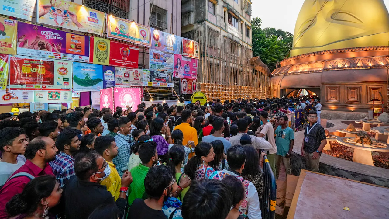 Devotees in large numbers at a community 'Puja pandal' on 'Maha Saptami' of Durga Puja festival, in Kolkata, Saturday, Oct. 21, 2023.