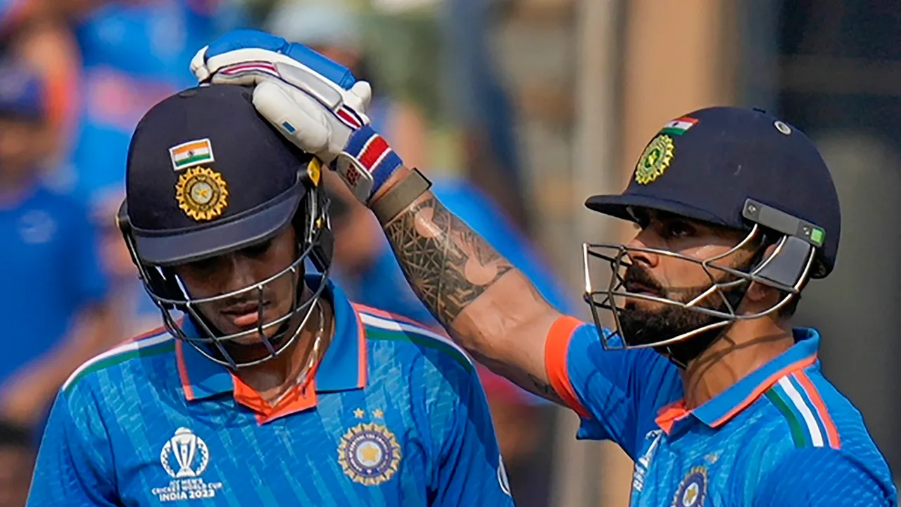 India's Virat Kohli greets Shubman Gill as he celebrates scoring fifty runs during the ICC Men's Cricket World Cup 2023 semi-final match between India and New Zealand