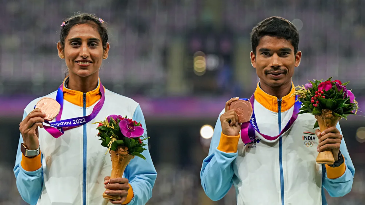 Bronze medalists India's Ram Baboo and Manju Rani pose for photos during the presentation ceremony of the 35km Race Walk Mixed Team event at the 19th Asian Games, in Hangzhou, China, Wednesday, Oct. 4, 2023.