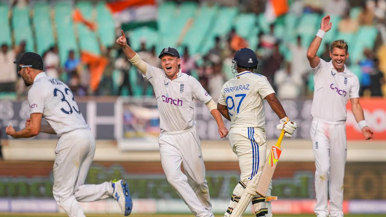 England's players celebrate the wicket of India's batter Sarfaraz Khan during the third Test cricket match between India and England, at Niranjan Shah Stadium, in Rajkot, Thursday, Feb. 15, 2024.