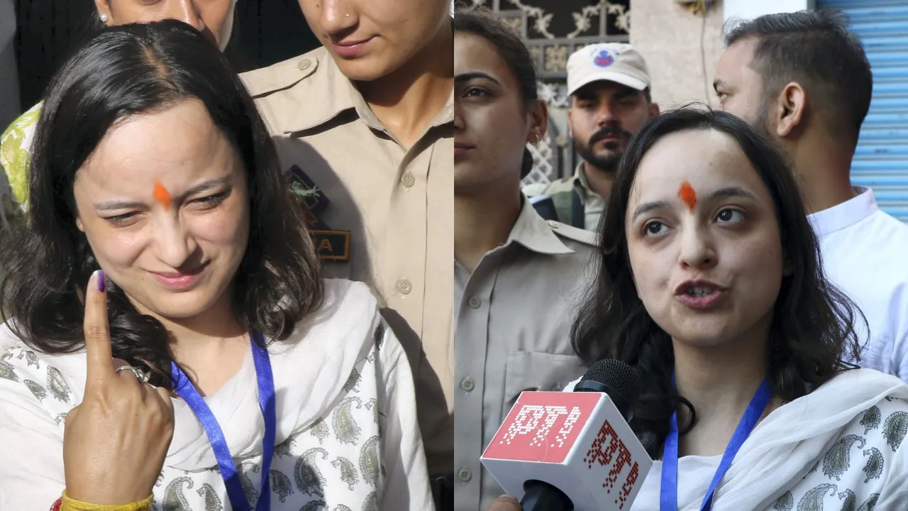 BJP candidate from Kishtwar constituency Shagun Parihar shows her finger marked with indelible ink after casting vote during the first phase of Jammu and Kashmir Assembly elections, in Kishtwar district, Wednesday, Sept. 18, 2024.