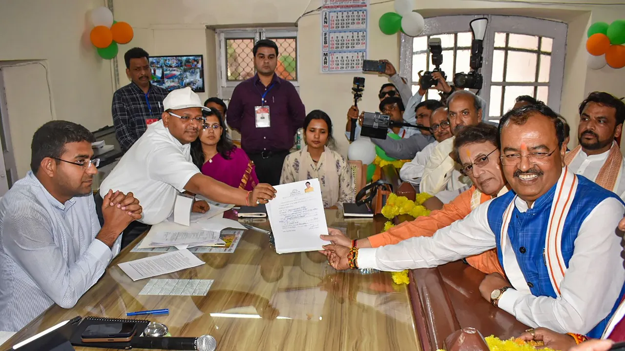 Actor and BJP candidate Arun Govil (in orange 'kurta' on right) files his nomination for the upcoming Lok Sabha elections in presence of UP Deputy CM Keshav Prasad Maurya, in Meerut, Tuesday, April 2, 2024