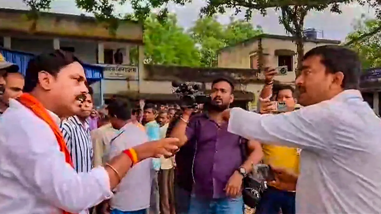 TMC and BJP leaders clash outside a polling station during voting for the 3rd phase of Lok Sabha elections, in Murshidabad, Tuesday, May 7, 2024