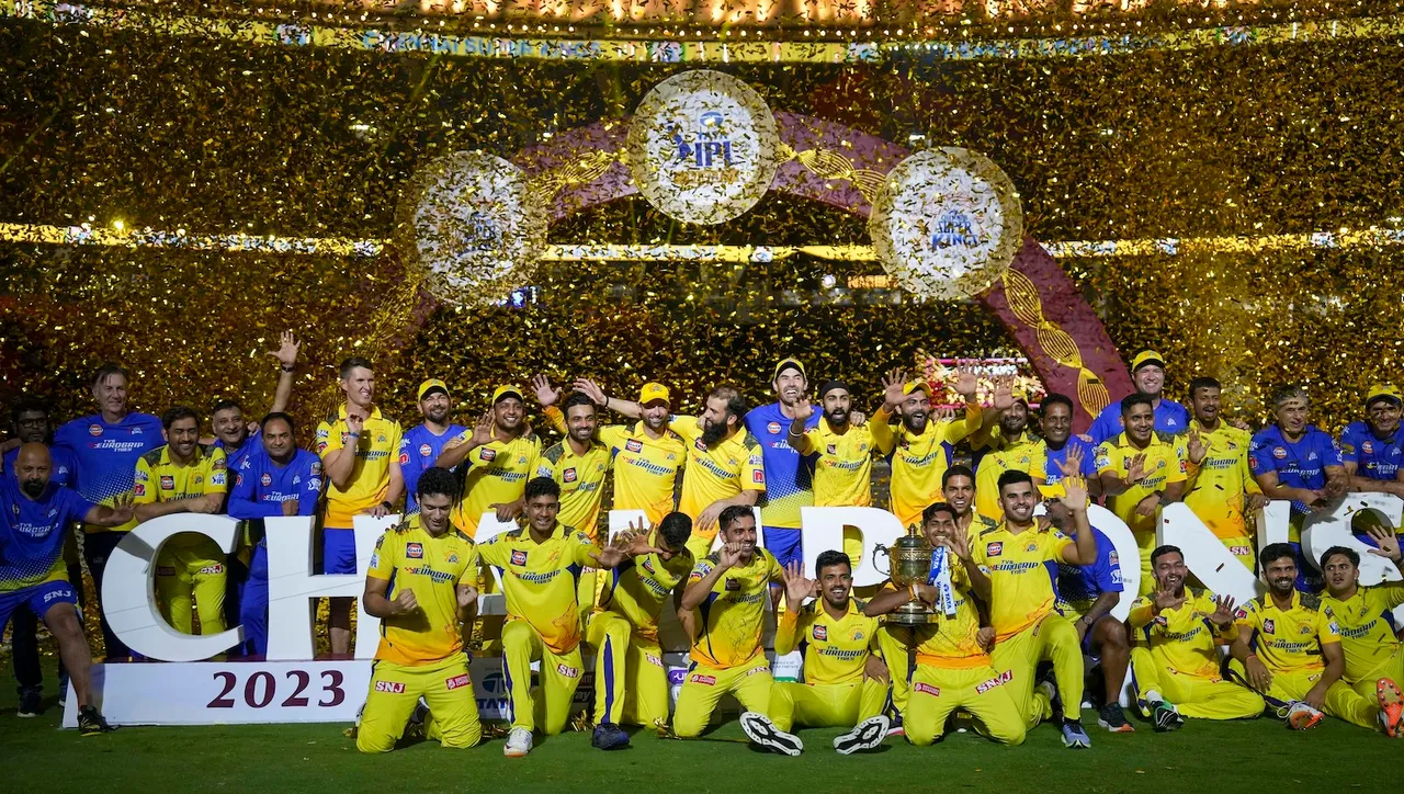 Chennai Super Kings players celebrate with the trophy after winning the Indian Premier League (IPL) 2023, at the Narendra Modi Stadium in Ahmedabad, Tuesday, May 30, 2023. Chennai beat defending champions Gujarat Titans by 5 wickets in the final
