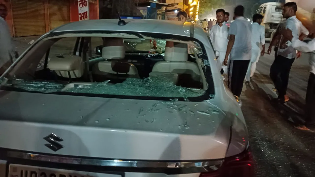 People stand near a vehicle that was allegedly vandalised by some unidentified men outside the Congress office at Gauriganj in Amethi, Sunday night, May 5 2024