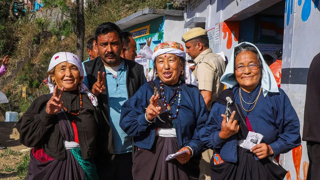 Voters show their fingers marked with indelible ink after casting their votes for the first phase of Lok Sabha elections, in Chamoli district, Friday, April 19, 2024