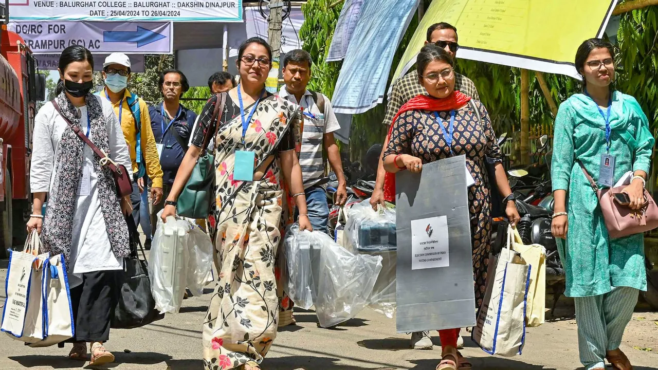 Polling officials with EVMs and other election material leave for poll duty