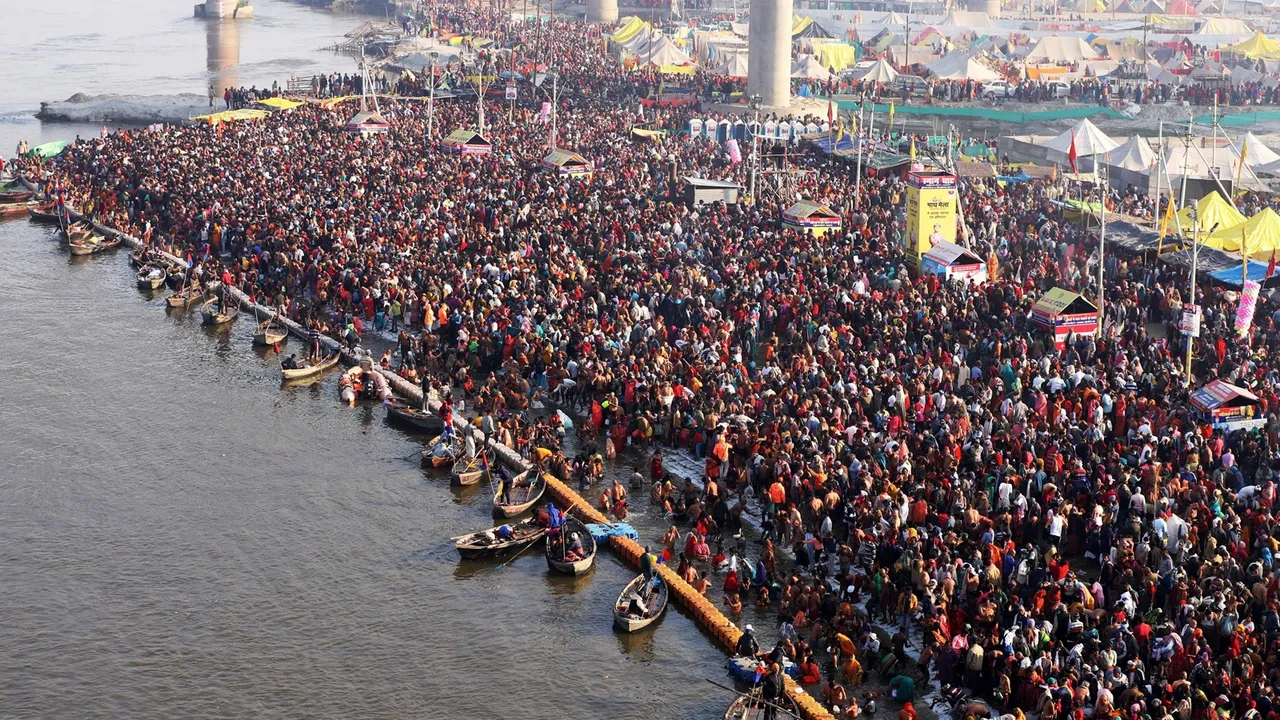 An aerial view of devotees taking a holy dip in the Ganga river on the occasion of ‘Mauni Amavasya’ during the annual religious 'Magh Mela' festival, in Prayagraj