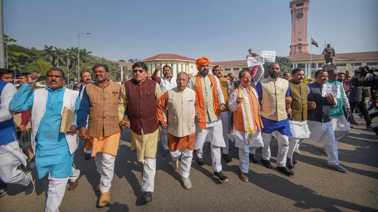 Leader of Opposition in the Bihar Assembly and BJP leader Vijay Kumar Sinha (4th from right) with legislators shouts slogans during a protest against Bihar government over the Chhapra Hooch tragedy