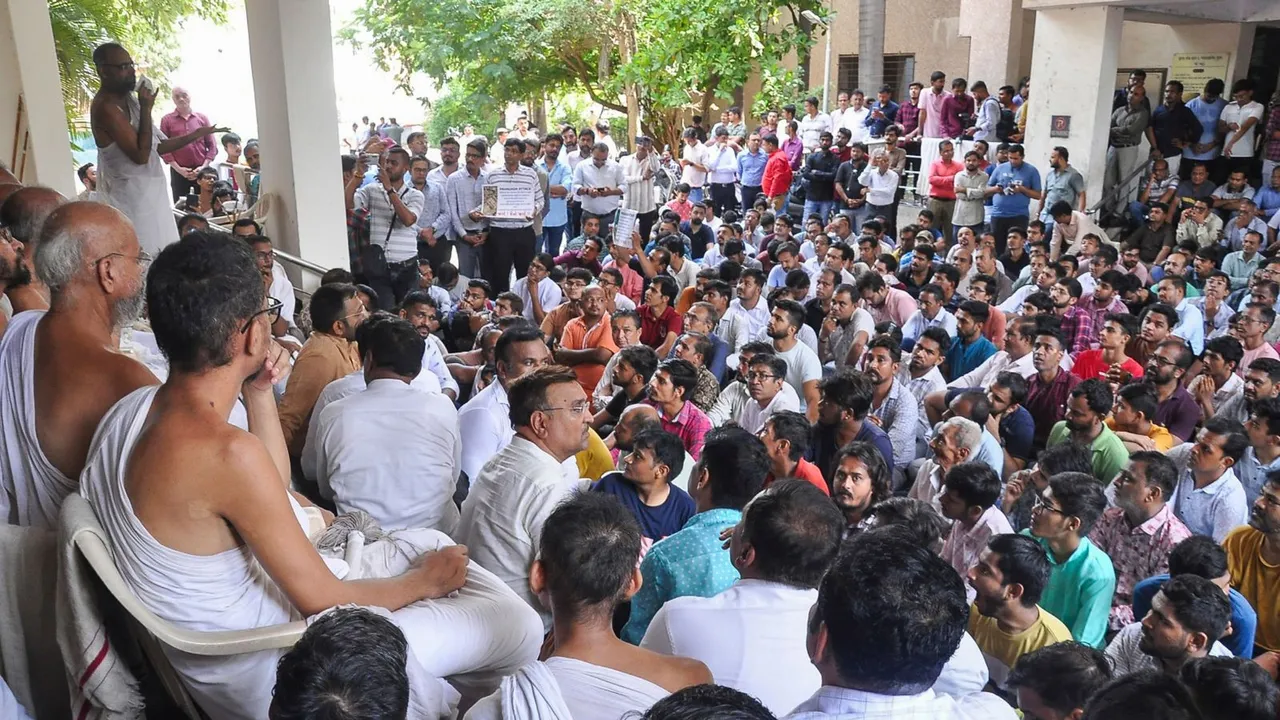 People from the Jain community gather outside Collector's office to submit a memorandum against demolition of a Jain temple in Pavagadh, in Surat, Monday, June 17, 2024.