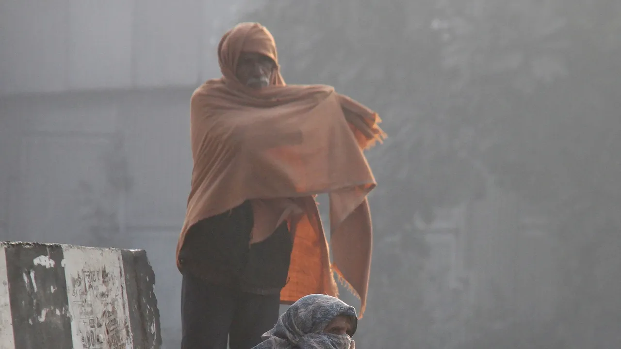 Elderly people during a cold and foggy winter morning