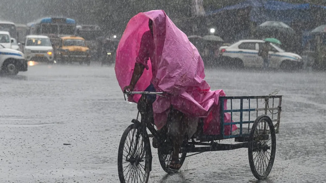 A man rides his cart during heavy rains, in Kolkata, Saturday, June 29, 2024.