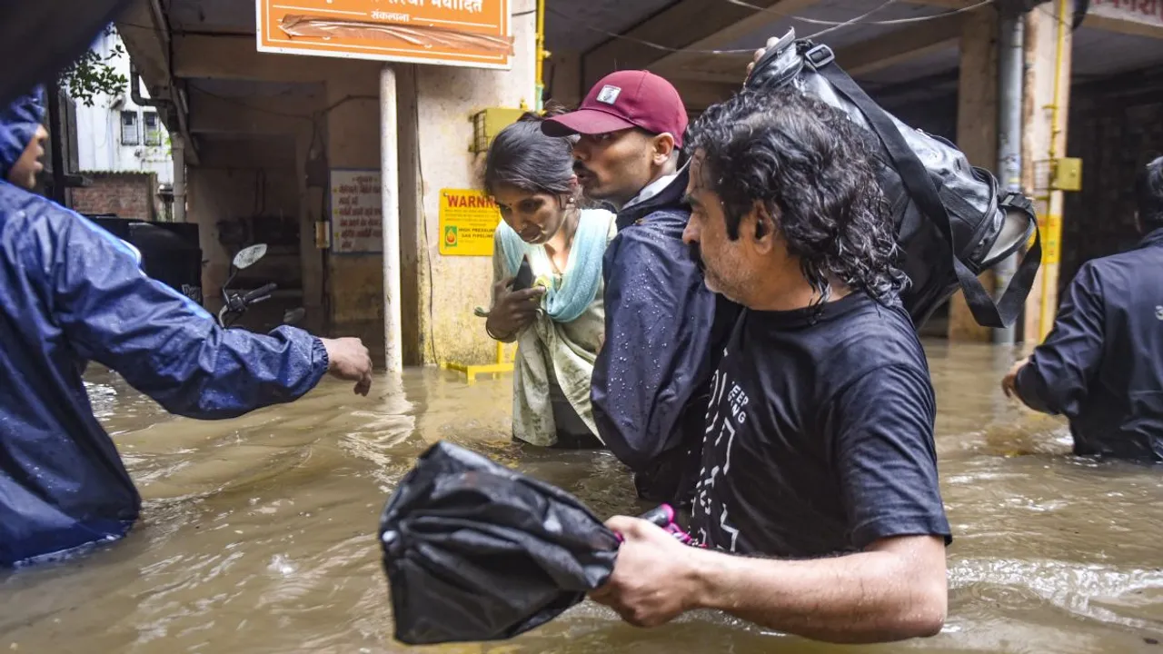 Locals being evacuated due to heavy waterlogging following incessant rains, in Pune district, Thursday, July 25, 2024