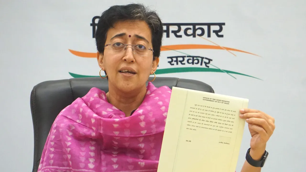 Delhi Minister and AAP leader Atishi Singh shows Delhi Chief Minister Arvind Kejriwal's first direction from ED custody on running the city government during a press conference, in New Delhi