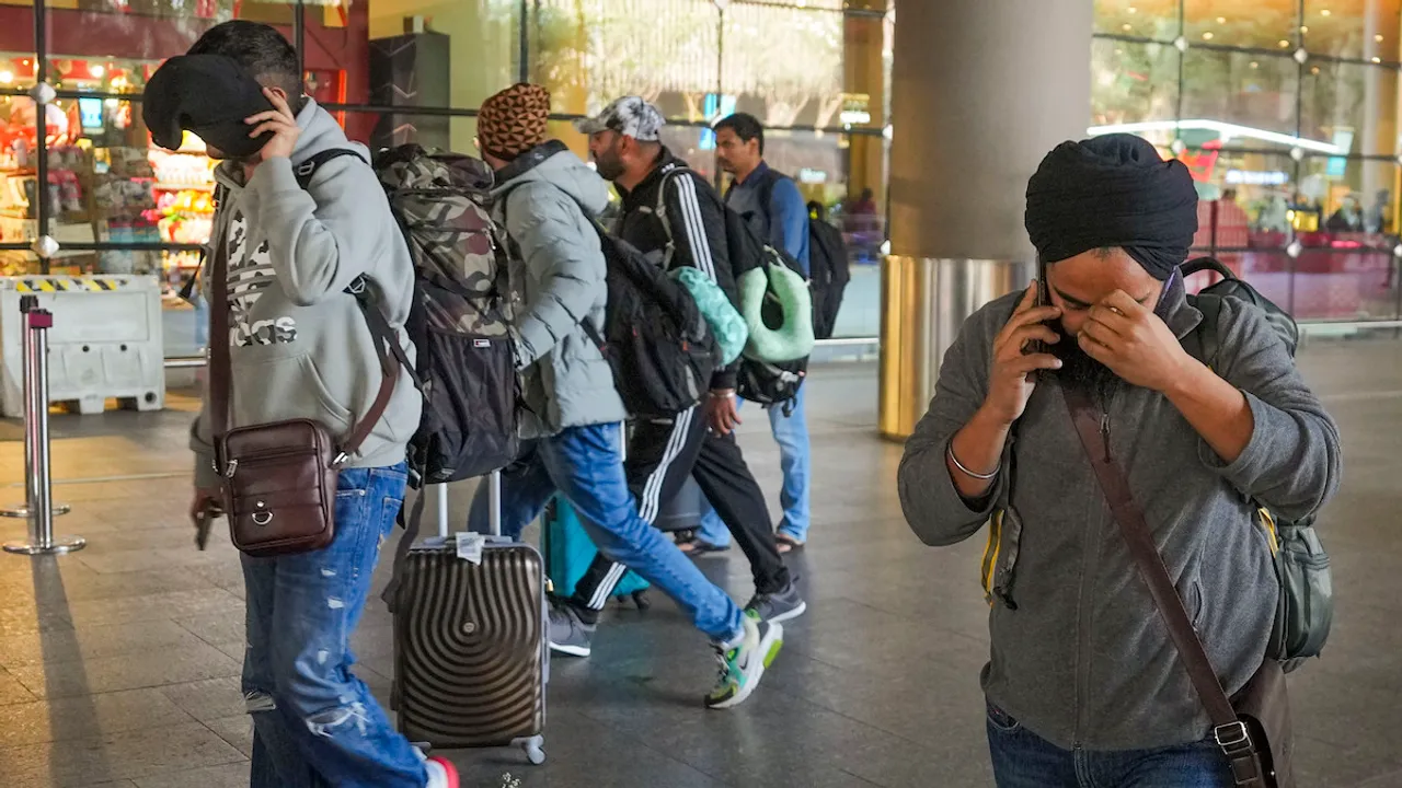 Passengers of a charter plane, which was grounded in France for four days over suspected human trafficking, arrive in Mumbai on Tuesday, Dec. 26, 2023.