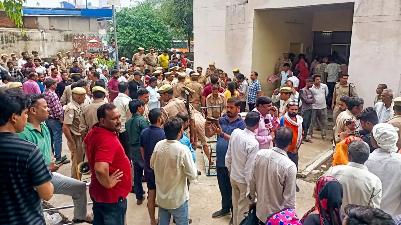 Relatives outside a hospital where victims of the Hathras' stampede are admitted, in Etah, Tuesday, July 2, 2024.