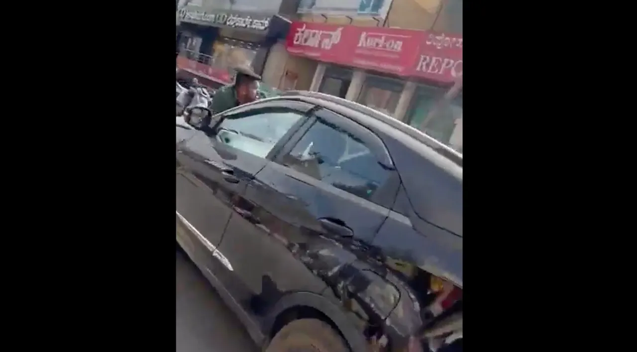 Girl drags man on car in Bengaluru