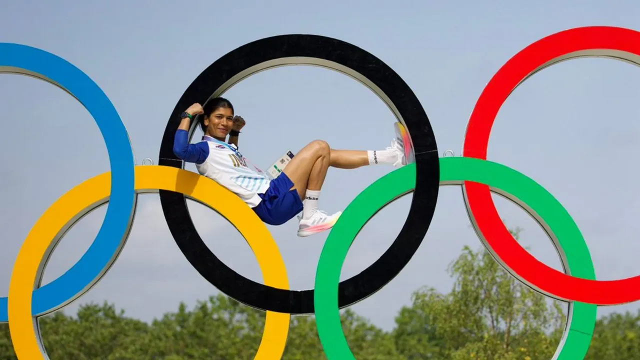 Boxer Nikhat Zareen poses on the Olympic rings ahead of the upcoming Paris 2024 Olympics in Paris