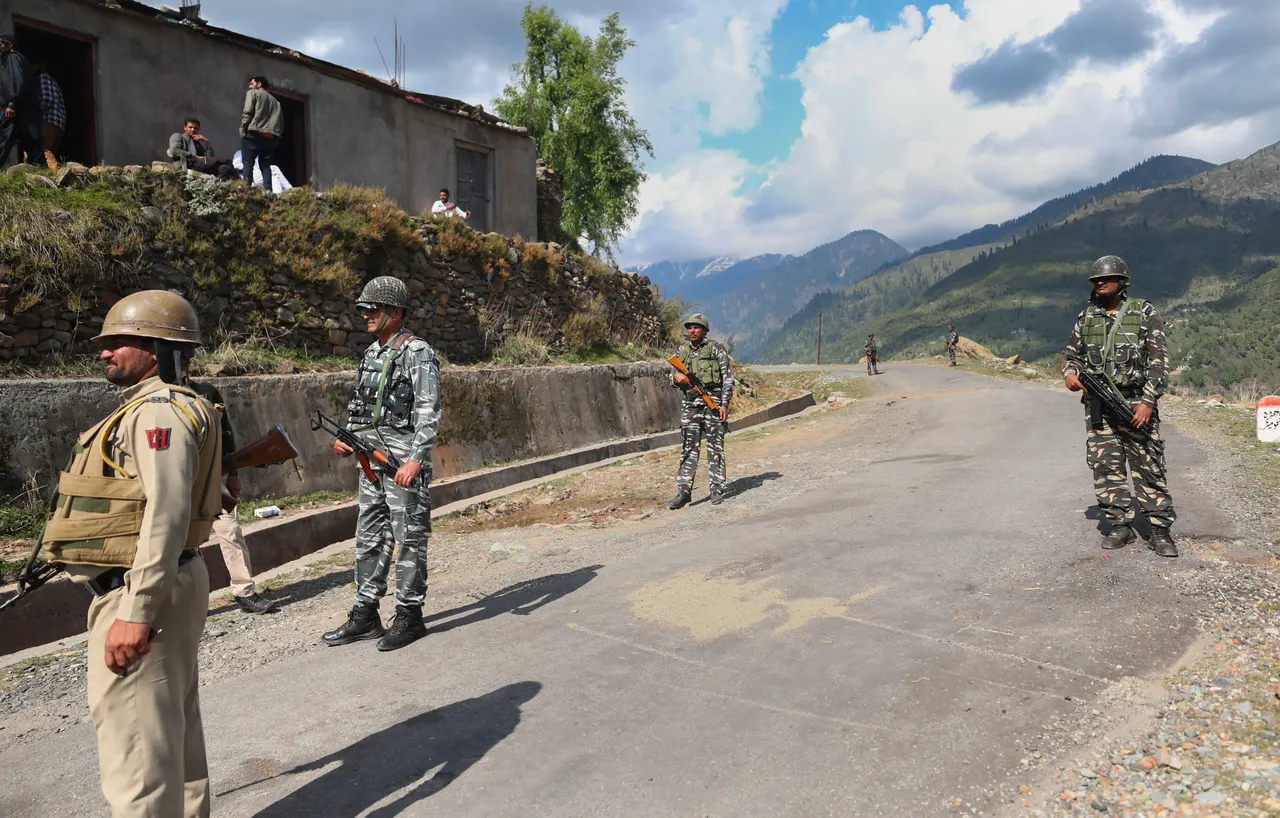 Security personnel near the site of an encounter with terrorists in Kandi area of Rajouri