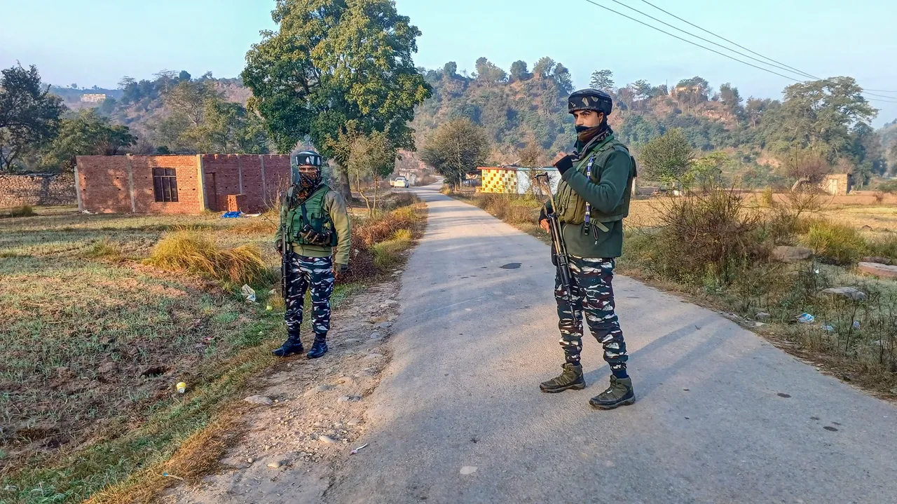 Security personnel stand guard during an encounter with terrorists, at Baji Maal area of Rajouri district