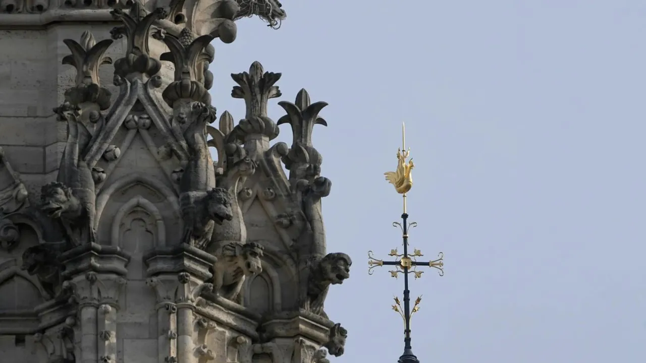 The cross and the rooster atop the Notre Dame de Paris cathedral spire, Thursday, March 14, 2024 in Paris