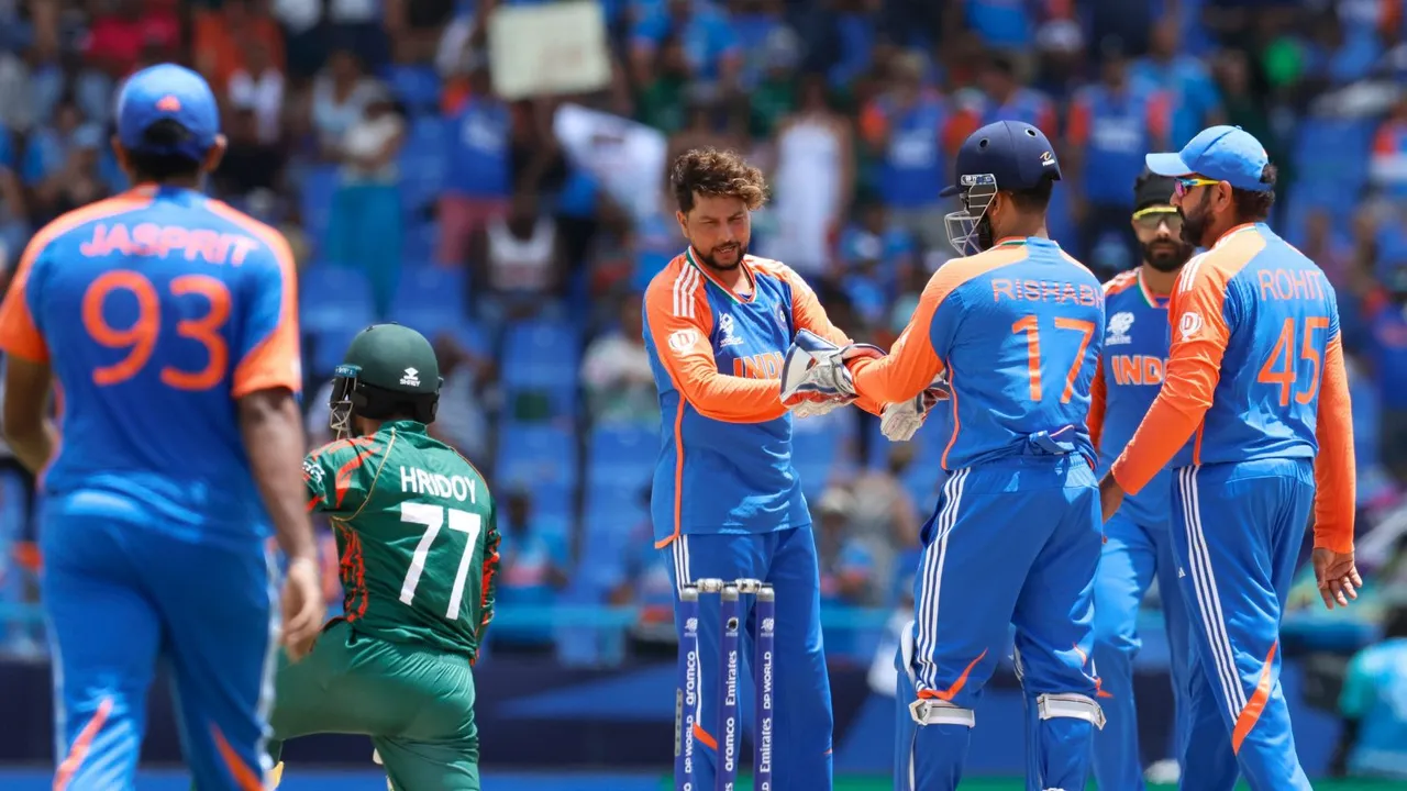 India's bowler Kuldeep Yadav with teammates during the ICC Men's T20 World Cup cricket match between India and Bangladesh