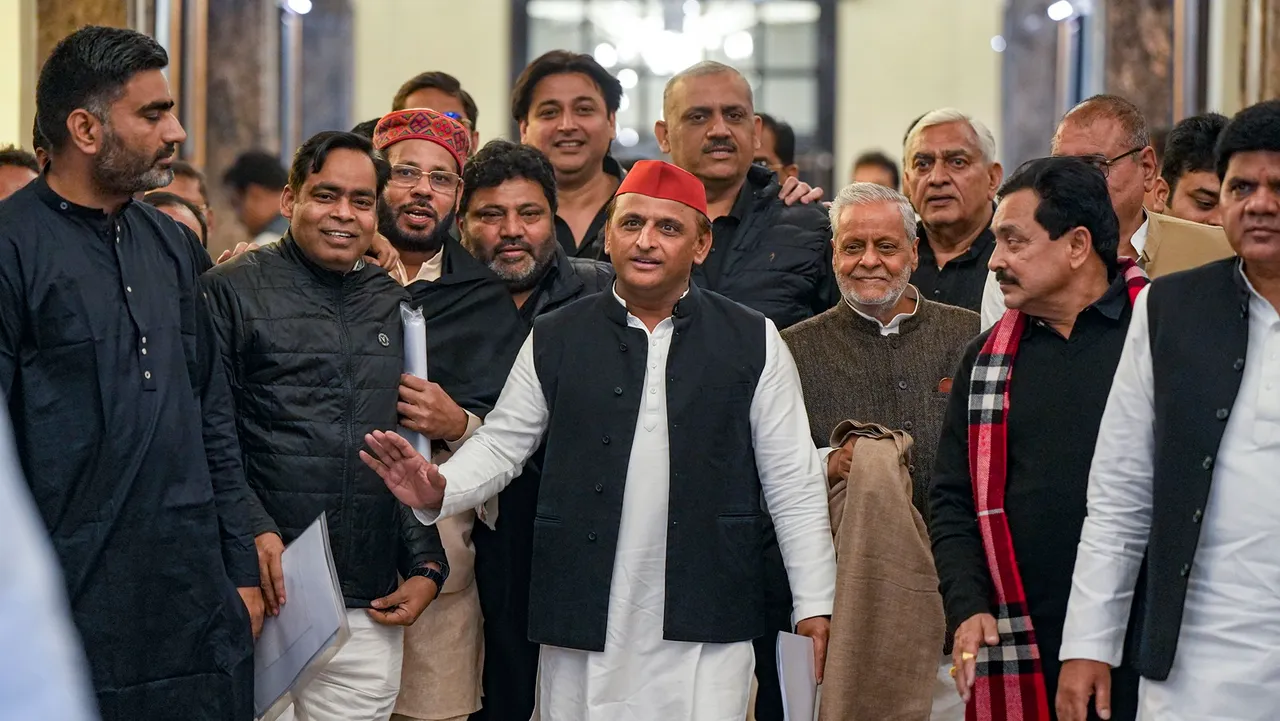  Samajwadi Party President Akhilesh Yadav with party MLAs arrives to attend the winter session of the Uttar Pradesh Assembly session, in Lucknow