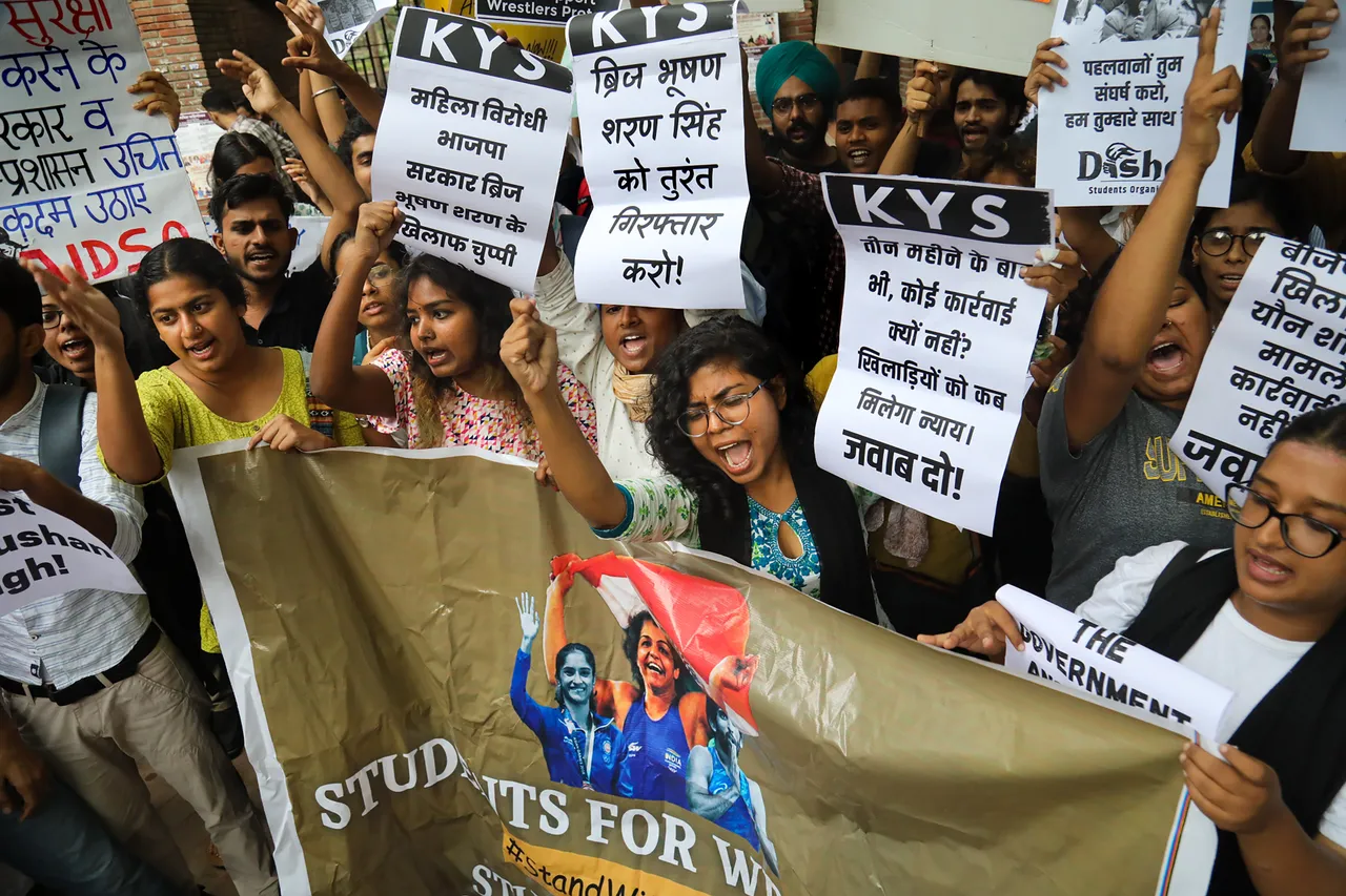Activists of various student unions raise slogans during a protest in support of wrestlers protesting against Wrestling Federation of India (WFI) chief Brij Bhushan Sharan Singh, at Delhi University's Art Faculty