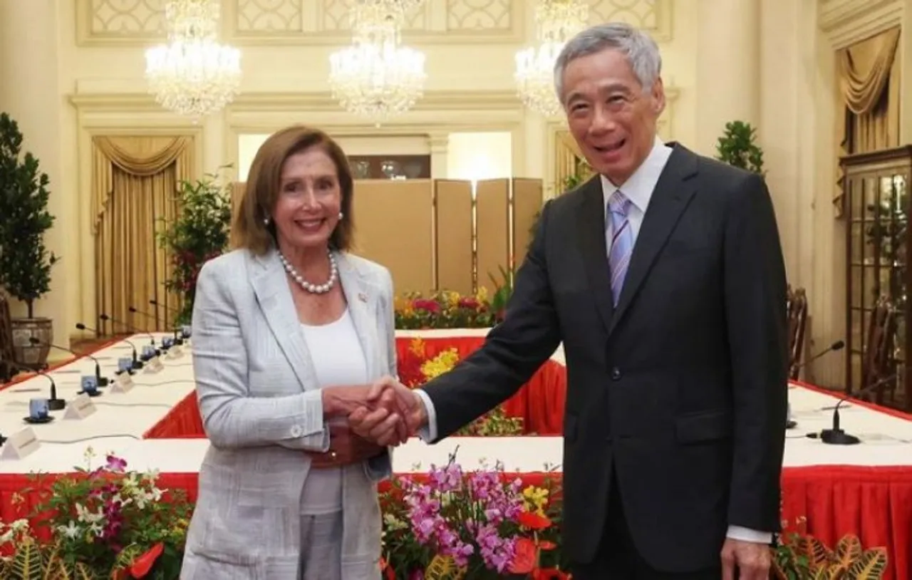 House Speaker Nancy Pelosi and Prime Minister Lee Hsien Loong shake hands at the Istana Presidential Palace in Singapore on Monday.