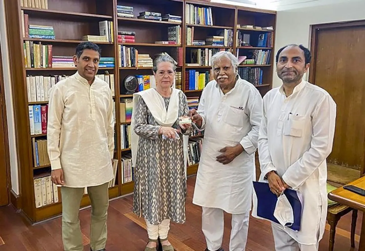 Congress interim President Sonia Gandhi being presented her QR-coded voter ID card and final list of delegates of electoral college by Congress Central Election Authority Chairman Madhusudan Mistry, in New Delhi