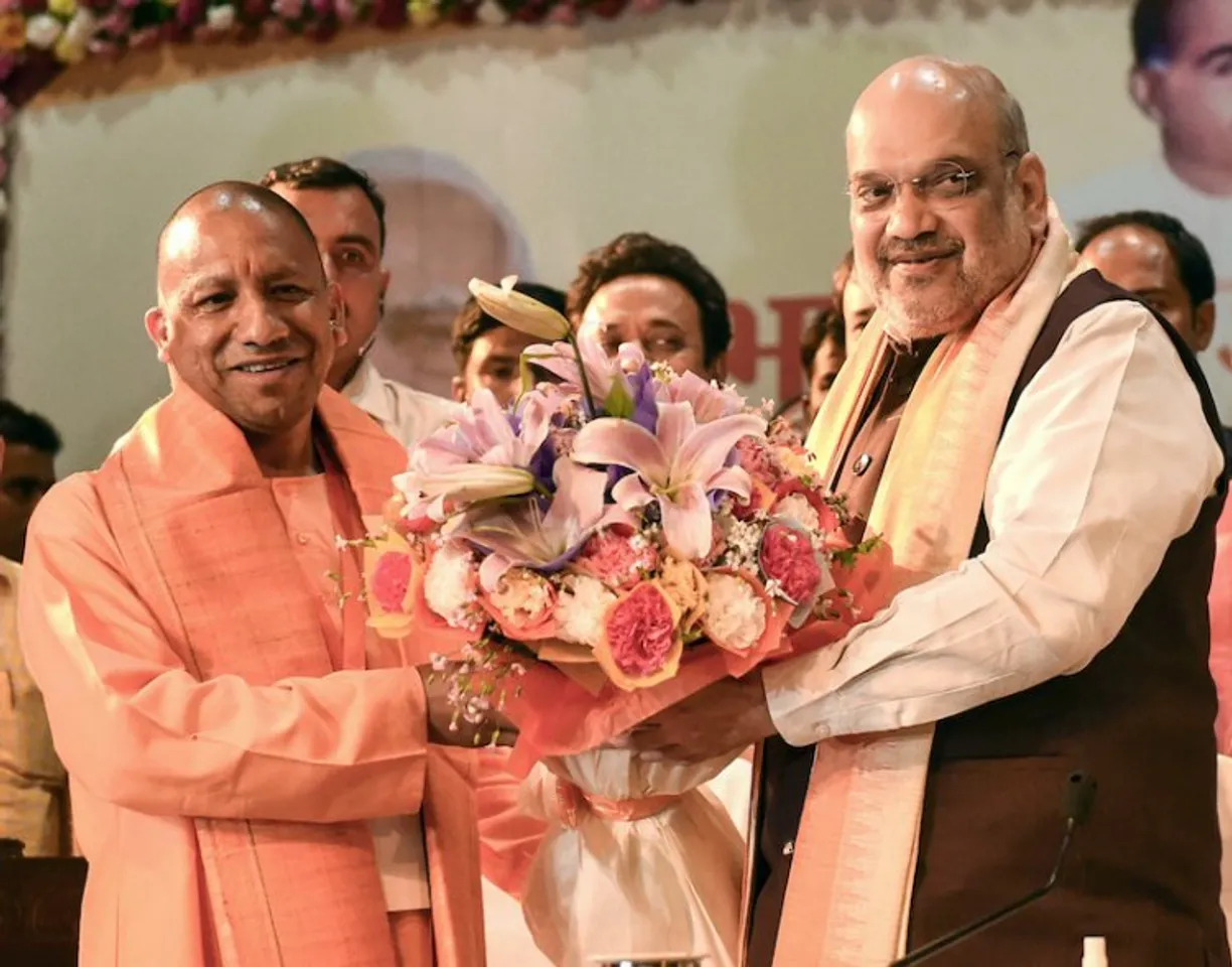 Amit Shah greeting Yogi Adityanath on being elected leader of BJP Legislature Party