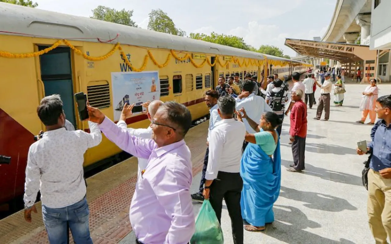 Commuters take photographs of newly launched Ahmedabad-Botad passenger train. PM Modi launched the train on Saturday.