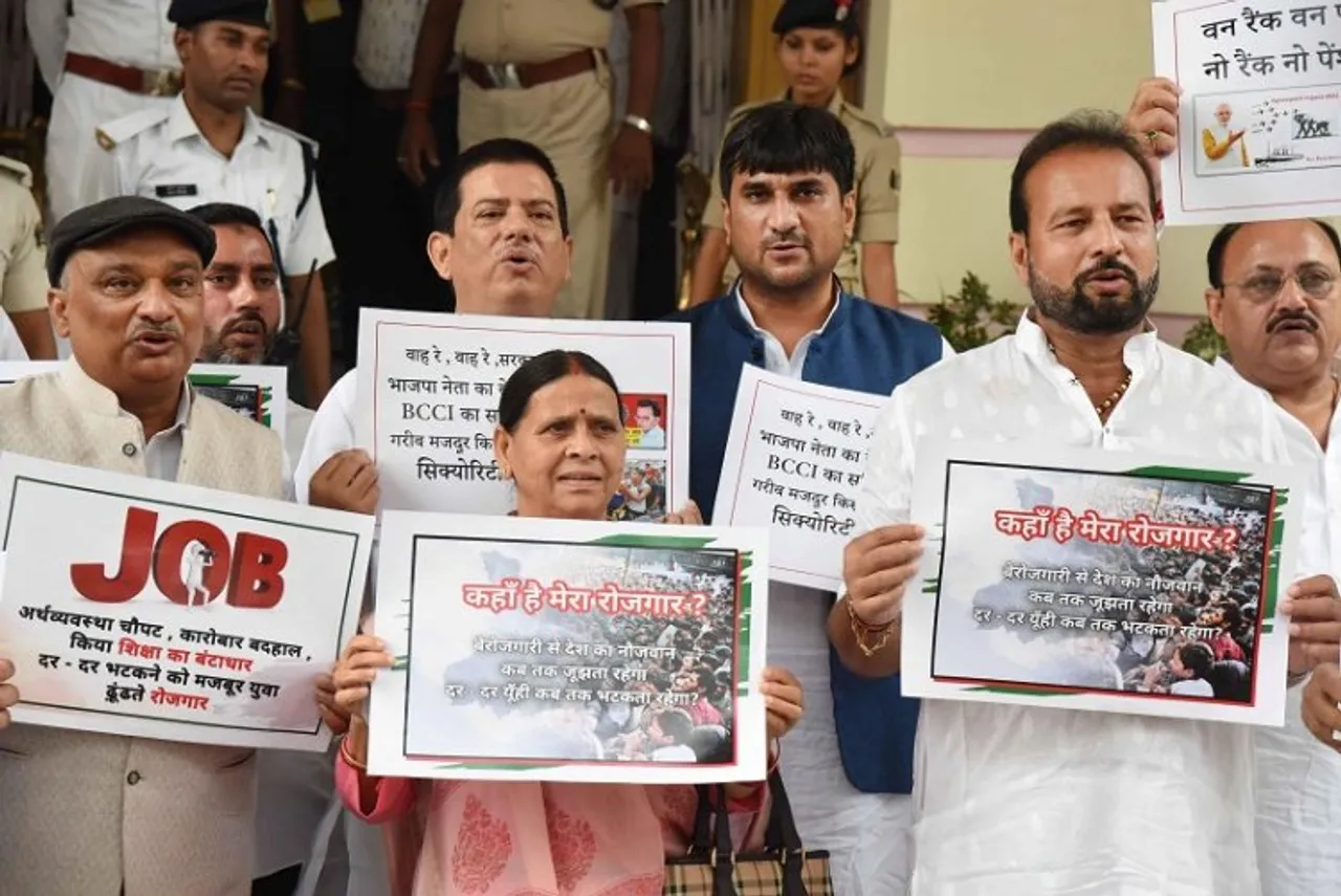 RJD leader Rabri Devi with party leaders stage a protest over the issue of unemployment during the ongoing Monsoon session of the Assembly, in Patna