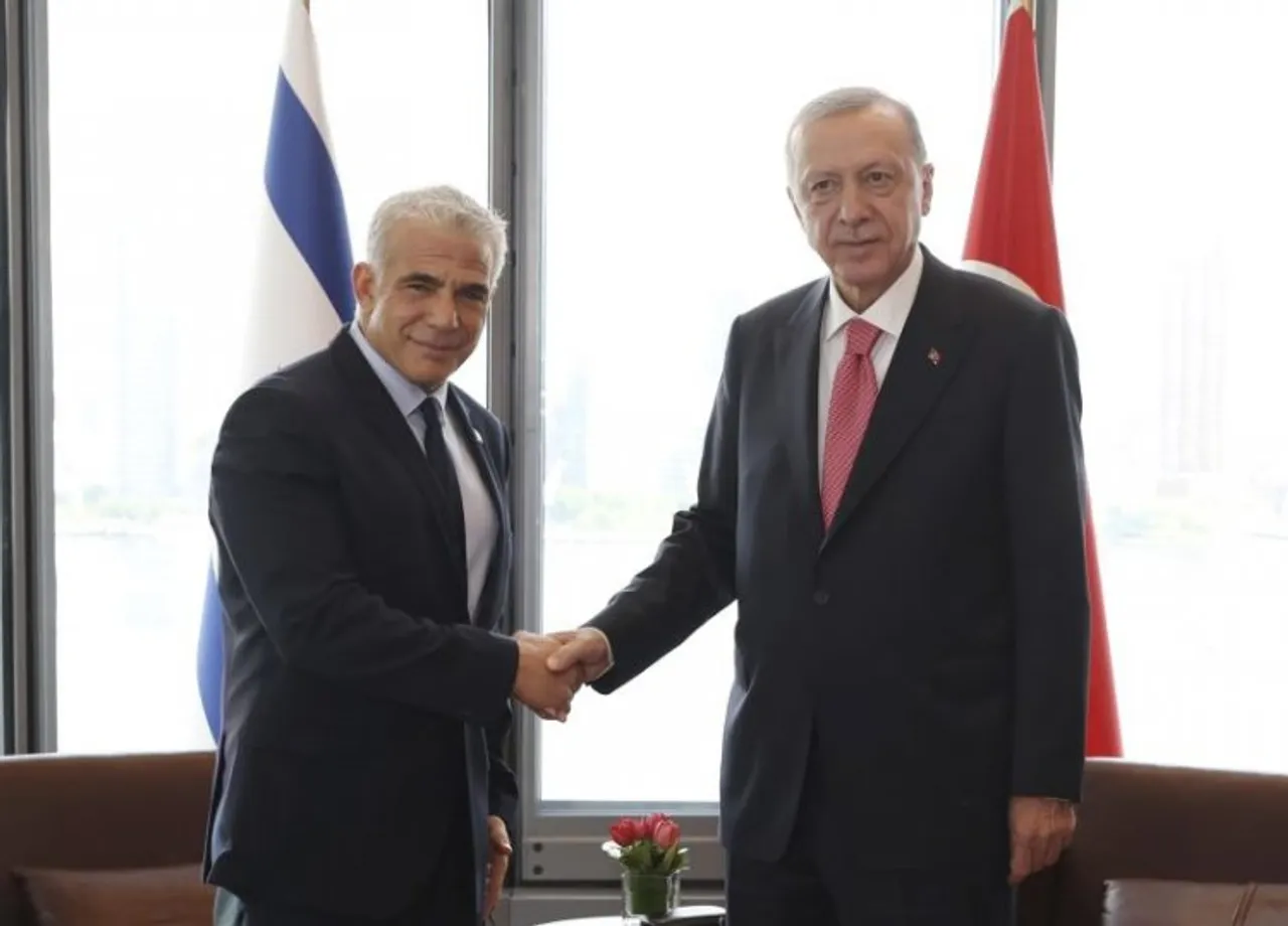 Israeli Prime Minister Yair Lapid and Turkish President Recep Tayyip Erdogan shakes hand during their meeting  on the sidelines of UN General Assembly
